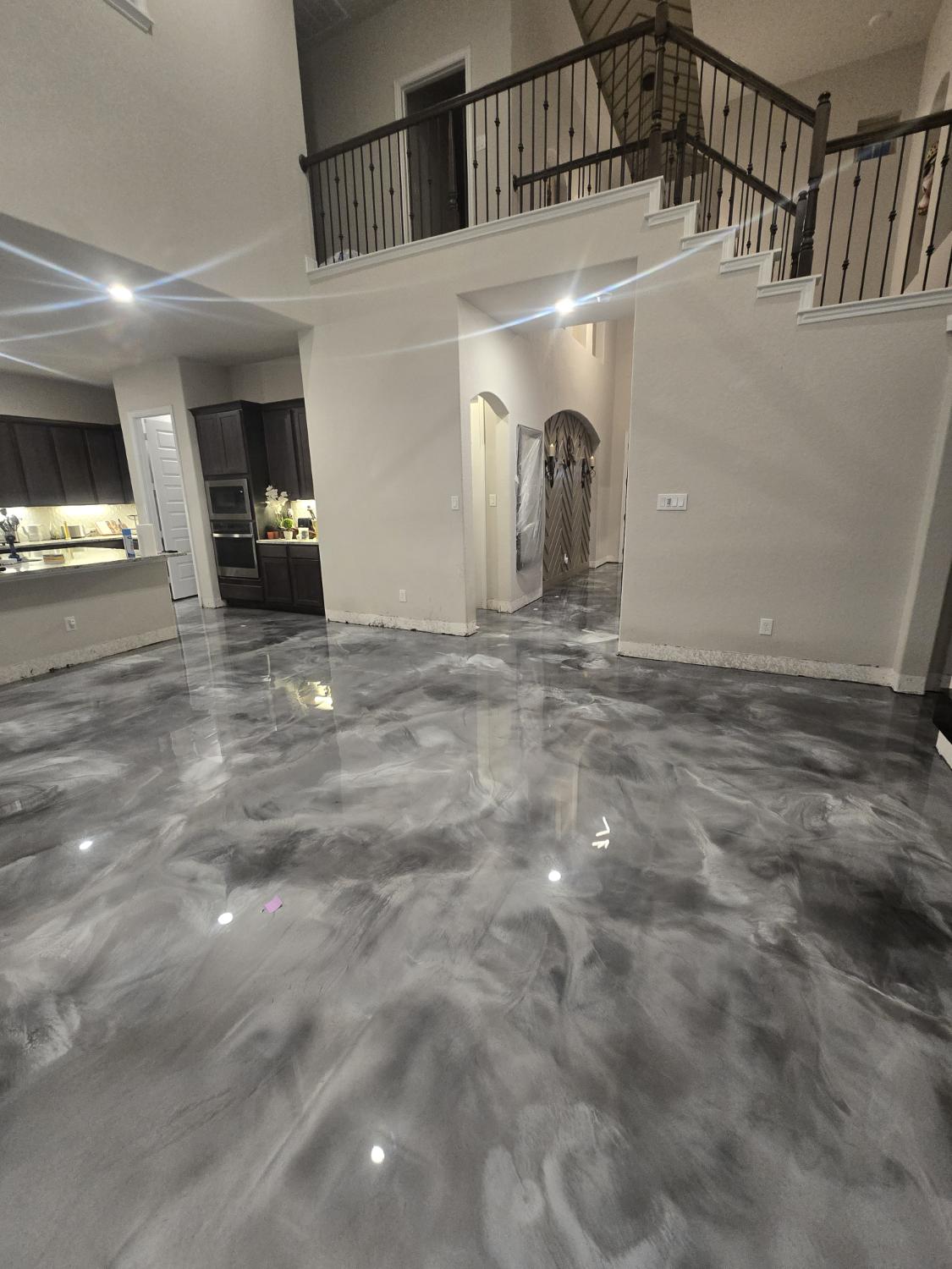 Metallic epoxy floor - gray marble look in luxury home