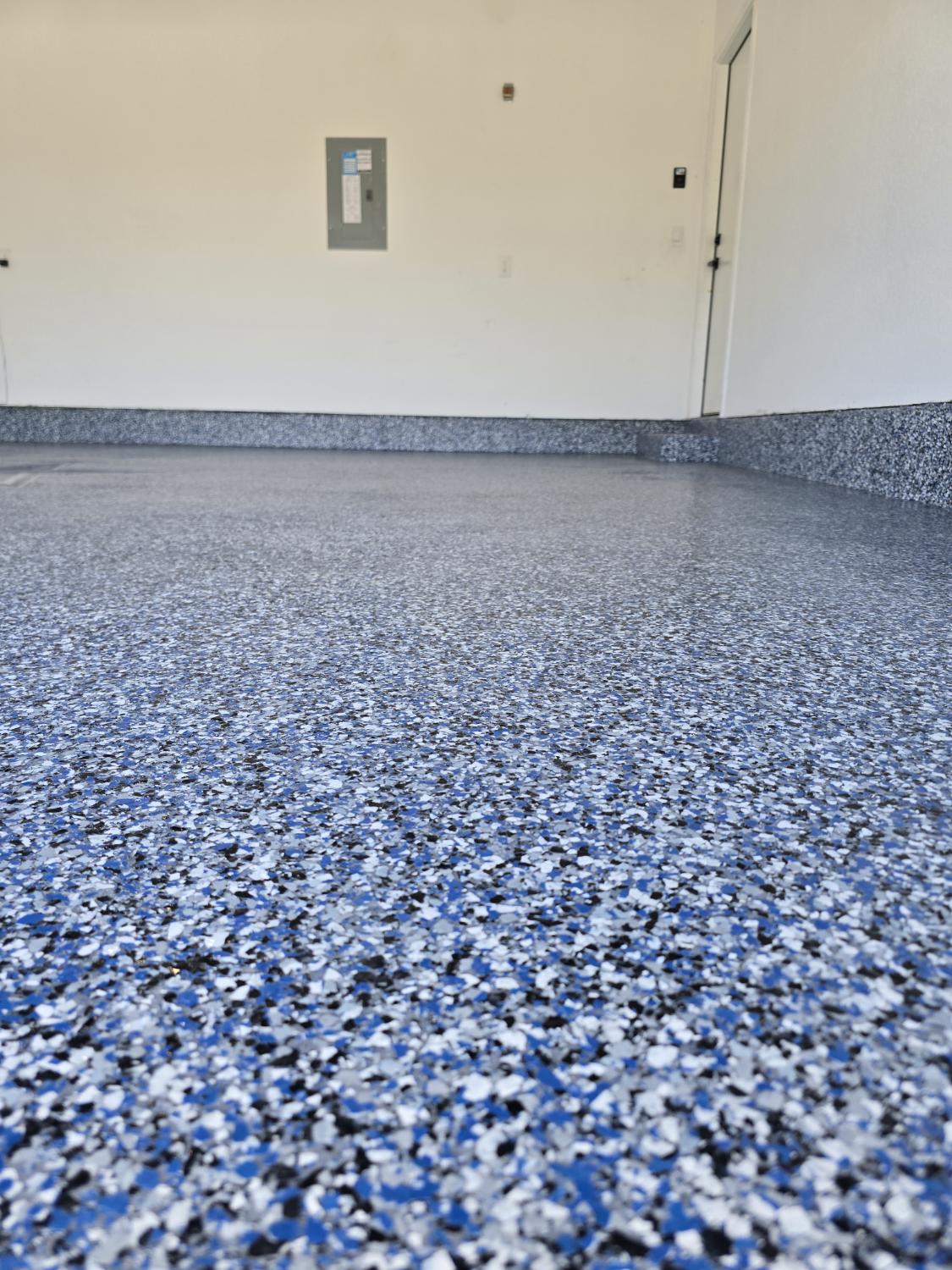 Blue and white flake epoxy garage floor